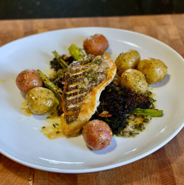 Crispy Skin Wild Black Bass with Beurre Blanc, Roasted Baby Potatoes, & Charred Broccolini